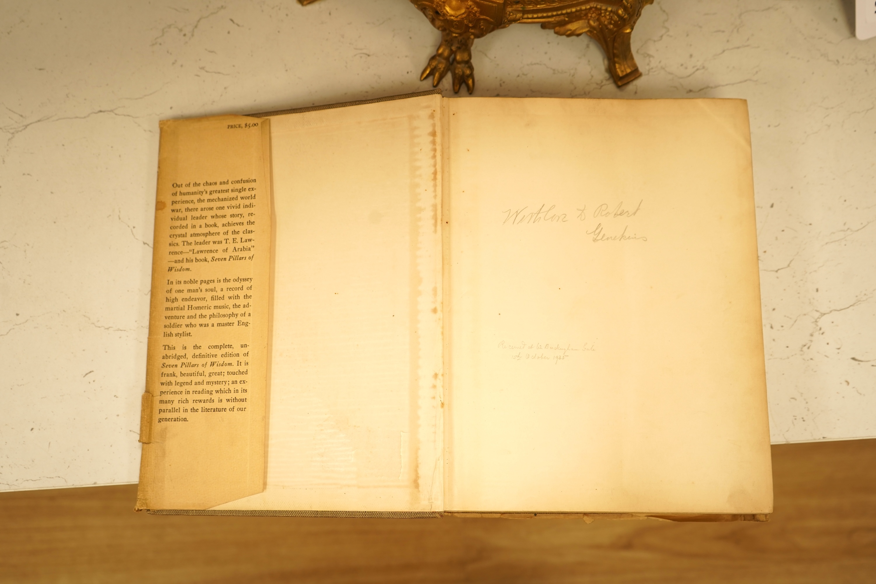 Lawrence, T.E. - Seven Pillars of Wisdom: a triumph. 1st US. trade edition. num. plates (many are portraits by Kennington and others), 6 text illus. and 4 maps (outline colour); publisher's gilt cloth and d/wrapper, roy.